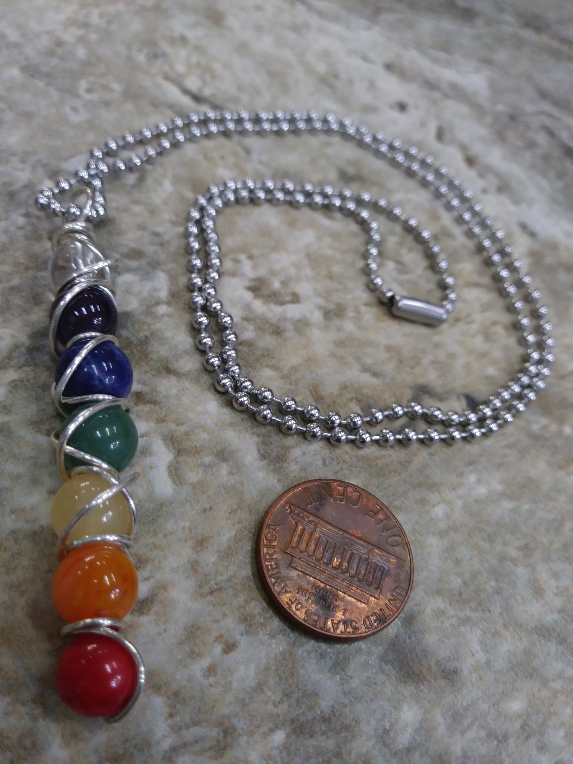 7 Chakra Necklace in Sterling Silver wrapping with Stainless Steel chain handmade in Ft Lauderdale South Florida Enchanted Jewelz Empire Black owned Metaphysical family friendly business 